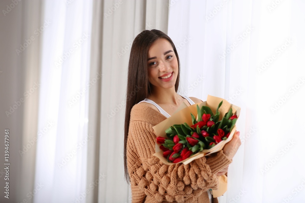 Happy woman with red tulip flowers bouquet in room. 8th of March celebration Happy woman with red tulip flowers bouquet in room. 8th of March celebration