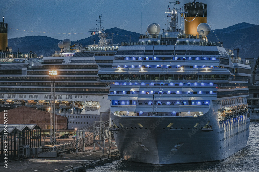 Family cruiseship or cruise ship Fascinosa in Marseille Provence, France port on windy summer day night sky during Mediterranean cruising dream vacation fully illuminated lights on