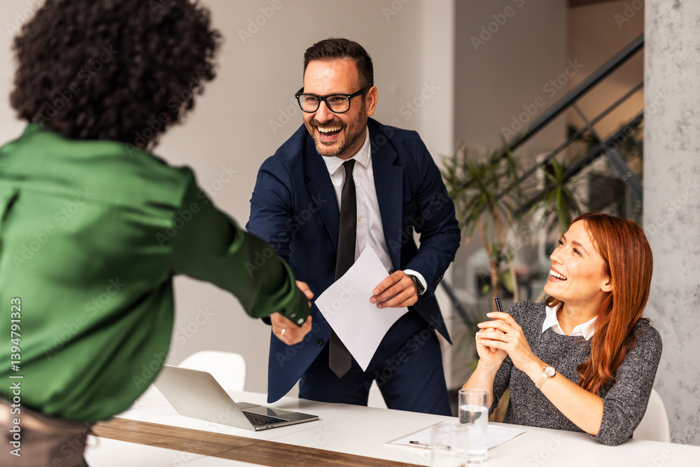Business Professionals Shaking Hands in a Positive Office Setting