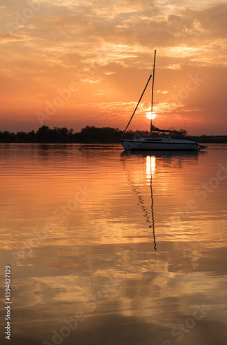 sunset on the lake with a boat
