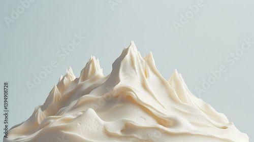 A cake styled as a minimalist mountain range with textured frosting peaks 