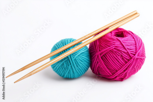Colorful yarn balls with knitting needles on a white background ideal for crafting enthusiasts and textile projects