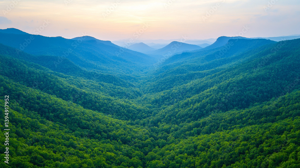 Fototapeta premium breathtaking view of lush green valley surrounded by mountains, showcasing beauty of nature during sunrise. vibrant foliage and rolling hills create serene atmosphere