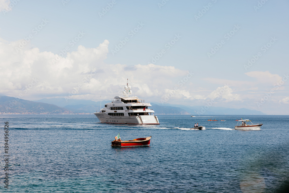 Luxury yacht navigating calm waters near portofino, italy Luxury yacht navigating calm waters near portofino, italy