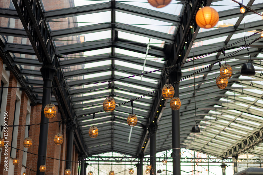 Garlands of lamps on the street. Light bulb decor, the string of lights on a urban background