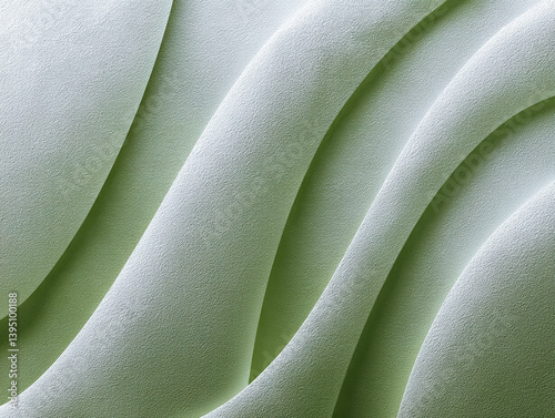 A close-up of textured, wavy surfaces in soft green tones, depicting a smooth and flowing design.