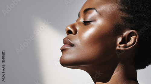 Close-up on hydrated melanin skin (African American woman) for modern skincare brands and campaigns