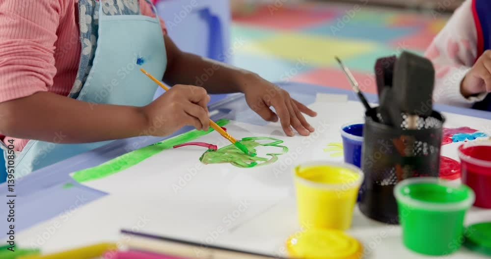 Hands, student and painting art in classroom with creative lesson, drawing picture and kindergarten learning. Kids, artist and sketch with fun activity, artwork project and motor growth for education