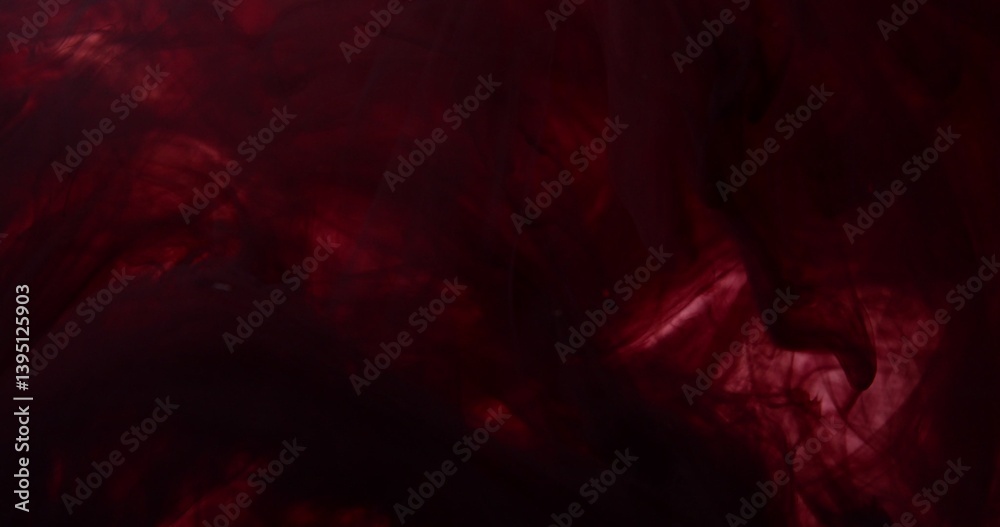 Fototapeta premium Spreading paint, abstract colors swirling and exploding. An organic background for visuals and motion graphics.