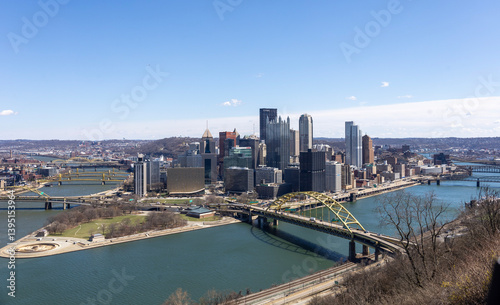 Pittsburgh, Pennsylvania, USA – March 25, 2024: A clear view of downtown Pittsburgh’s skyline from Mount Washington, featuring the U.S. Steel Tower and Fort Duquesne Bridge over the Allegheny River. photo
