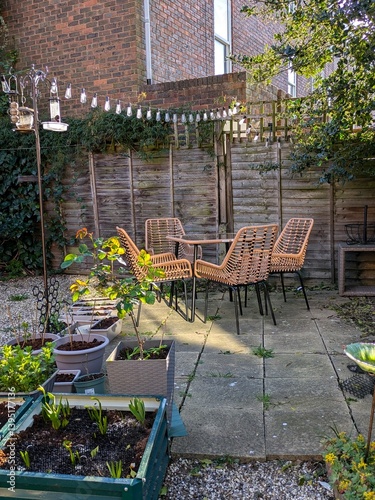 Rattan garden furniture in a small London garden