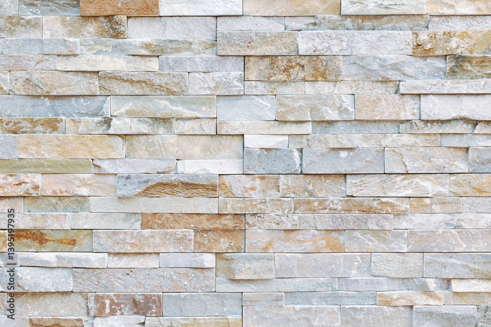 Fototapeta premium Textured Stone Facade: A close-up view of a meticulously crafted stone facade, showcasing the natural textures, colors, and intricate patterns of the stone.