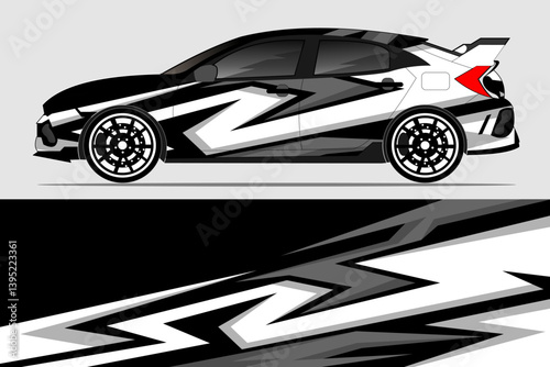 Stylish modified hatchback car with dynamic black and white design on a gray background