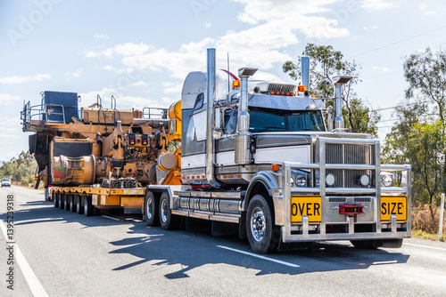 Over size load on truck transporting mining equipment