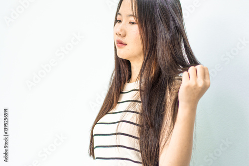 Combing with brush and pulls long hair. Daily preparation for looking nice, Long Disheveled Hair,Holding Messy Unbrushed Dry Hair In Hands. Hair Damage, Health And Beauty Concept.