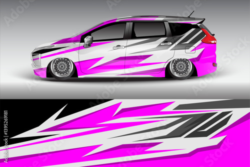 Stylish modified car with vibrant pink and silver graphics parked on a smooth surface, showcasing its unique design