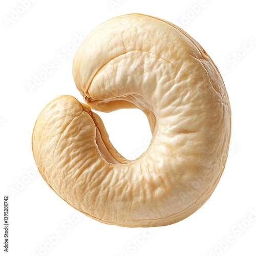 A single cashew nut close up shot showing its creamy beige color and unique curved shape