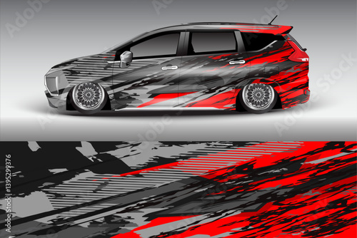 Stylishly modified car with a striking red and black design parked on a smooth surface
