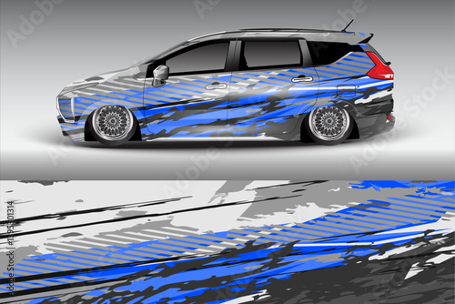 Sleek modified vehicle with striking blue and gray graphics parked against a gradient backdrop