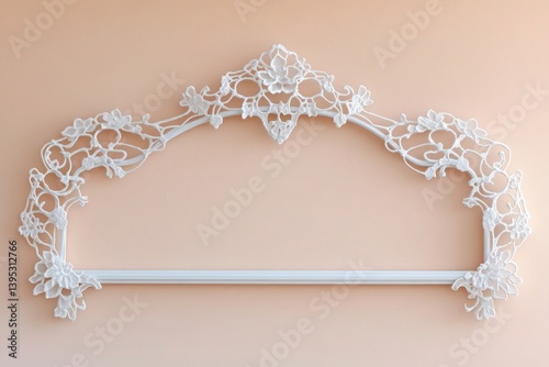 A delicate lace-like frame in white metal, showcased against a soft peach wall, giving a romantic, airy feel.