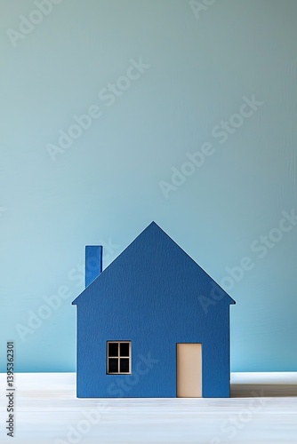 Blue minimalist house model, symbolizing tranquility and home comfort