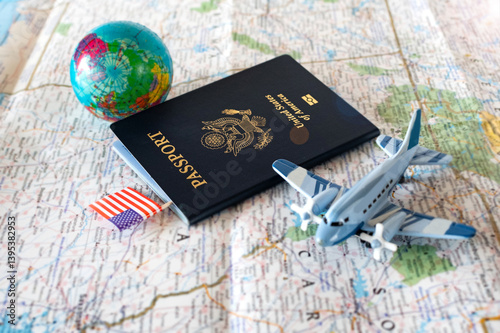 passport, globe and airplane model on world map background, travel concept