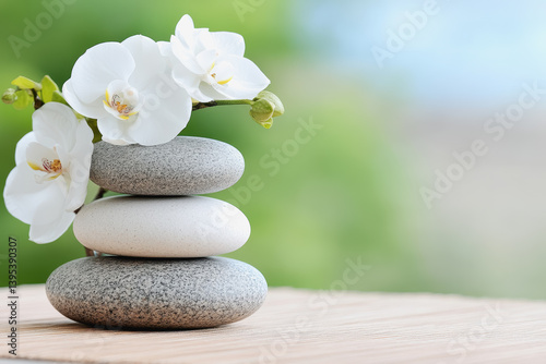 Neatly stacked rocks with a beautiful flower on top, creating a symbol of balance and natural beauty