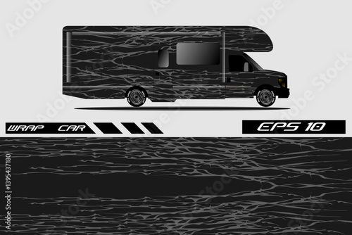 A sleek, modern RV design featuring an abstract black and gray wrap, showcasing its side profile against a neutral background