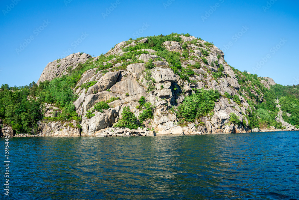 Scenic Rocky Hill with Lush Greenery by a Calm Fjord, Stavanger, Norway, June 2018