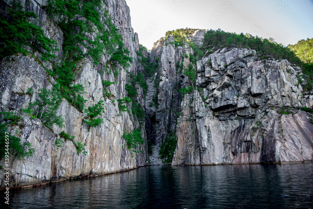 Majestic Rocky Cliff Overlooking Reflective Waters of Lysefjord Fjord, Stavanger, Norway, June 2018