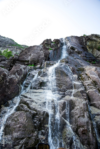 Scenic Waterfall Descending Over Rocky Cliffs into Lysefjord Fjord Waters, Stavanger, Norway, June 2018