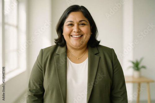 Joyful Middle-Aged Overweight Businesswoman in a Sunlit Studio, Modern Workplace Happiness