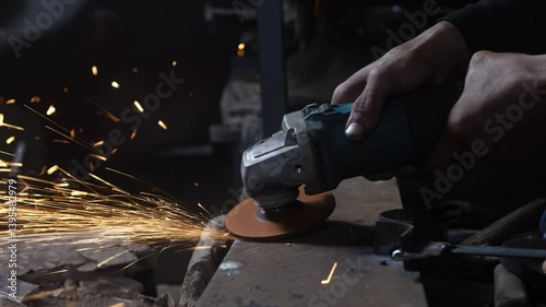 close up of man's hand grinding without using safety gloves. unsafe grinding work