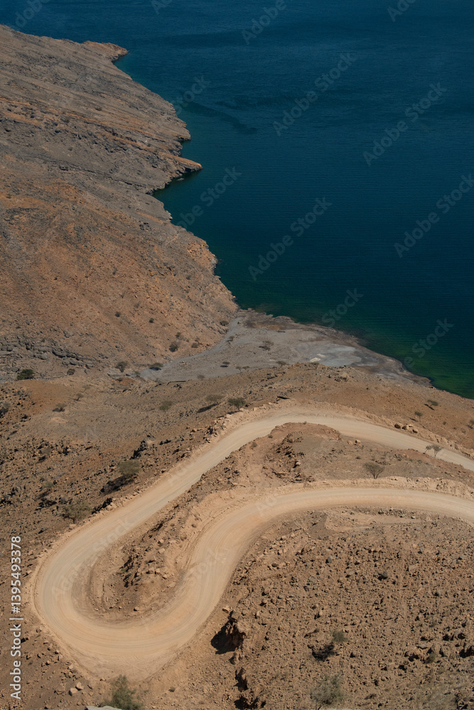 Oman, 03-06-2025: aerial view of the winding road to Khor Najd, stunning fjord in Musandam Peninsula (Ruus Al Jibal) known for its natural beauty, peaceful setting and bioluminescence of its waters