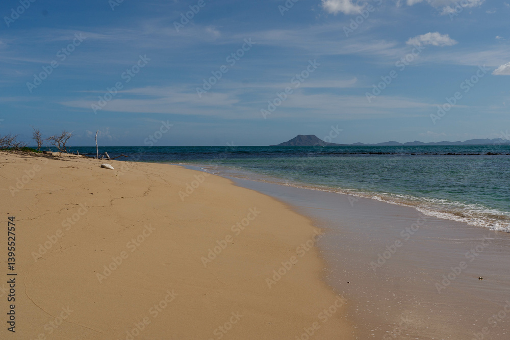 Fototapeta premium Sandy beach on one of the Seven Brothers Islands with El Morro mountain in the background. Dominican Republic.