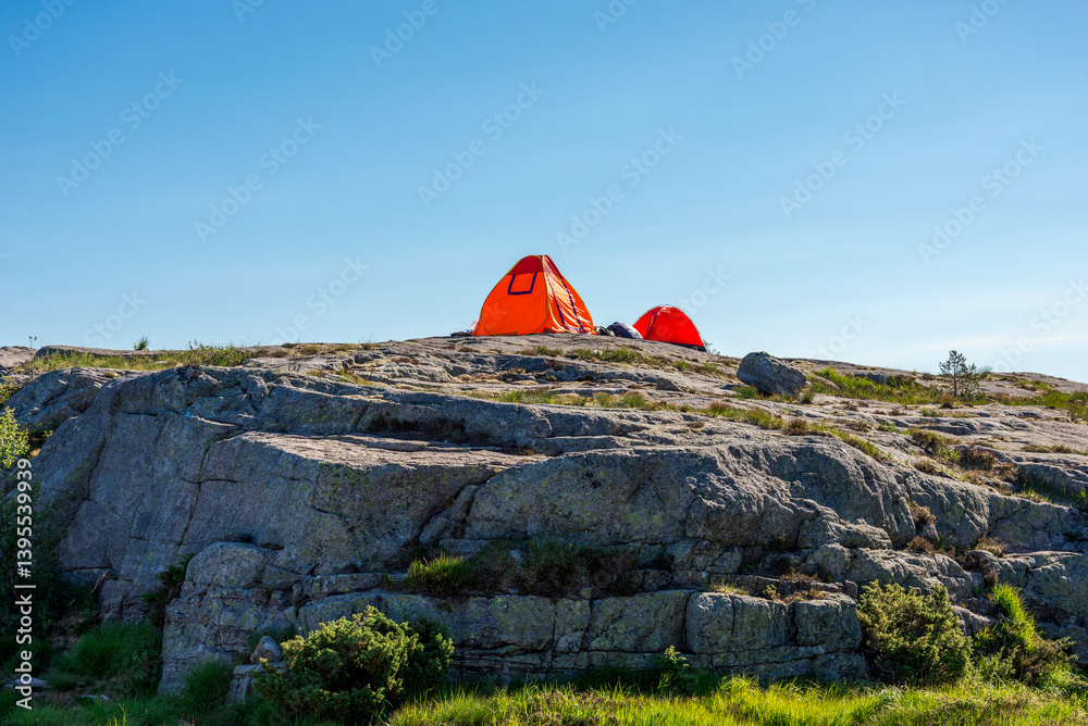 Camping Tents Pitched on a Rocky Cliff on Preikestolen Hiking Trail, Stavanger, Norway, July 2018