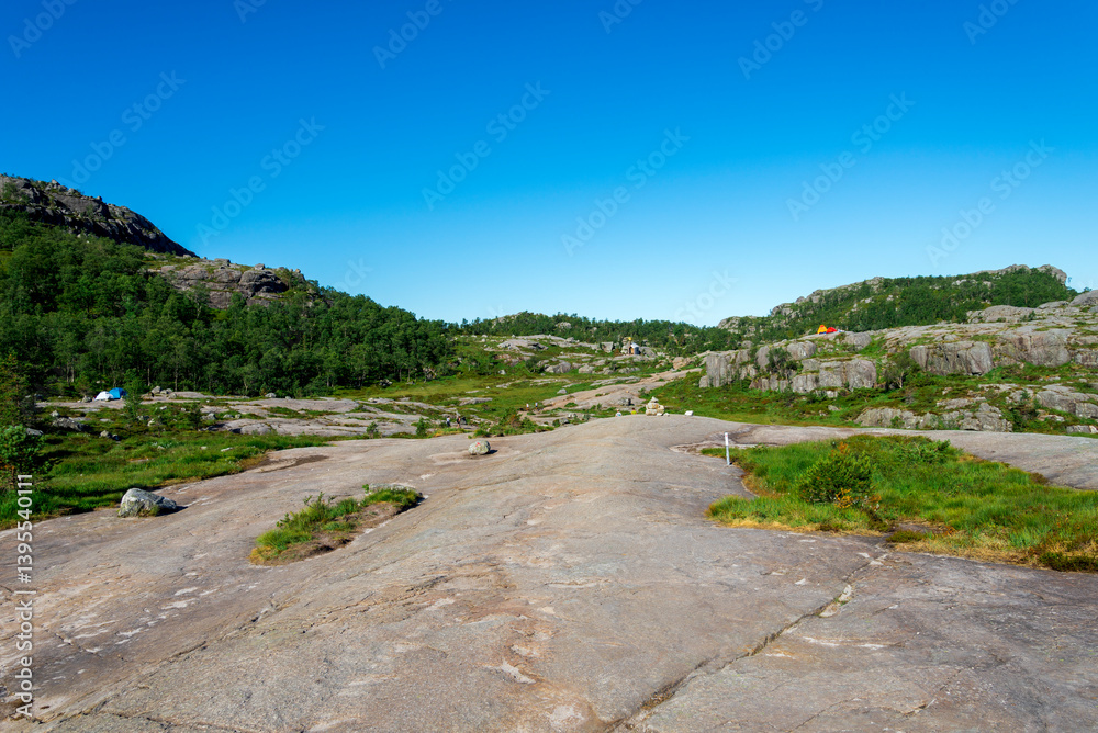 Scenic Landscape With Camping Tents and Hikers on Preikestolen Trail, Stavanger, Norway, July 2018