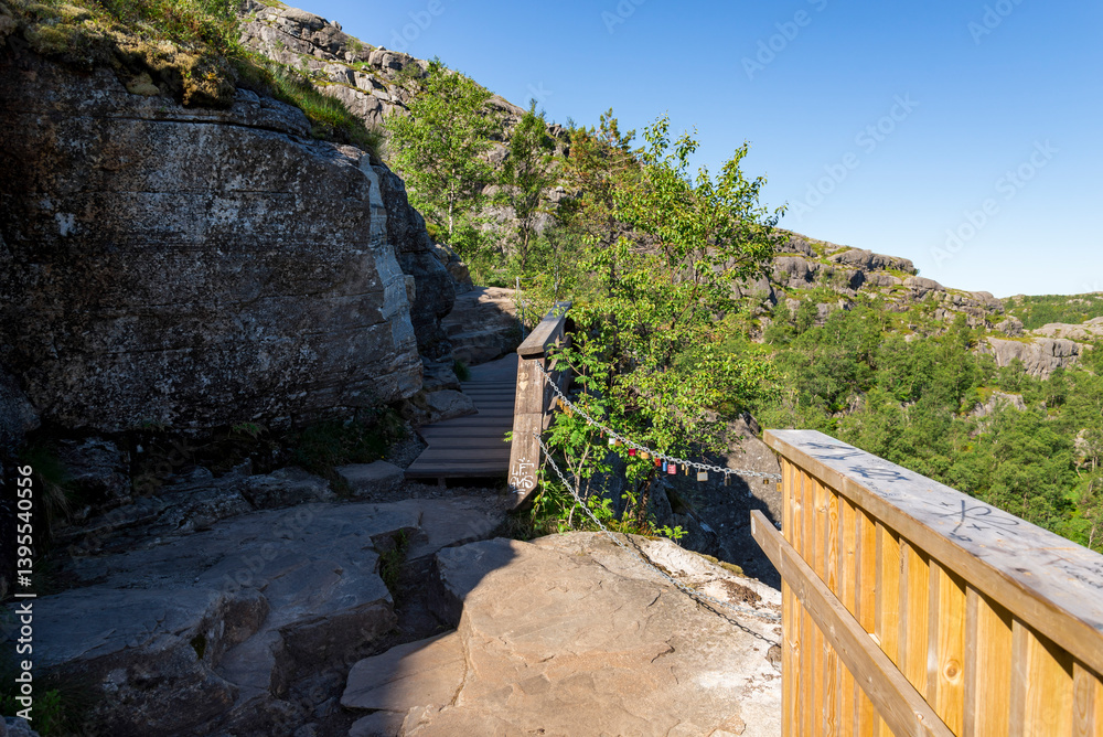 Wooden Boardwalk With Railing And Safety Chain Along Preikestolen Hiking Trail, Stavanger, Norway, July 2018