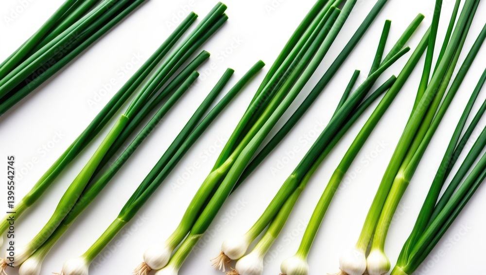 Fototapeta premium Fresh garlic chives displayed on a white background with clipping path, viewed from above.