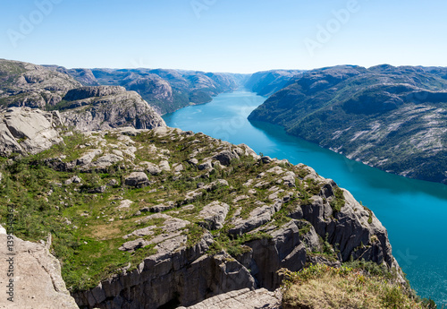 Obraz na płótnie Rugged Terrain of Rocky Plateau and Long Stretched Lysefjord Fjord, Stavanger, Norway, July 2018 w salonie