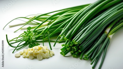 Healthy organic chives: fresh green vegetable, sliced, set against a white background.