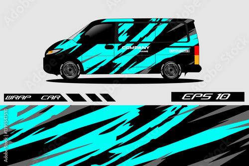 A vibrant, abstractly designed car wrap showcasing dynamic blue and black patterns on a compact van
