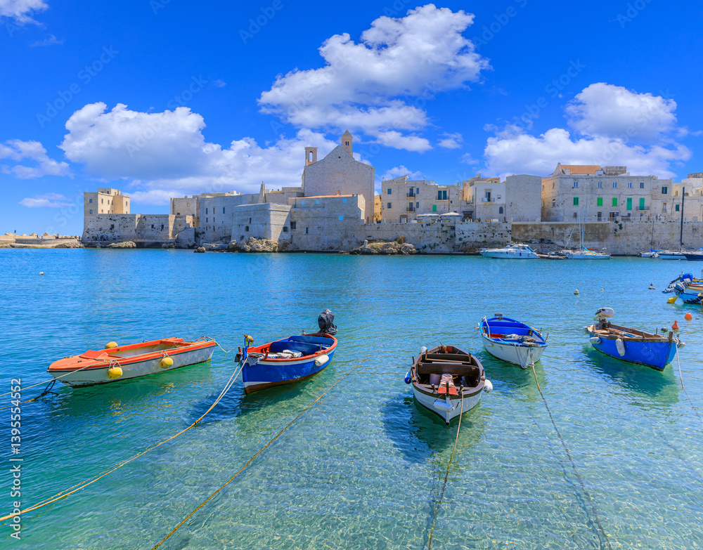 Obraz premium Giovinazzo old town in Apulia, Italy: view of the harbor with the Cathedral of Santa Maria Assunta in Apulian Romanesque style.