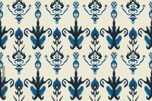 Seamless ikat pattern with abstract tribal motifs in black and earthy tones on a light beige background, traditional textile design perfect for fabric, wallpaper, and fashion use.