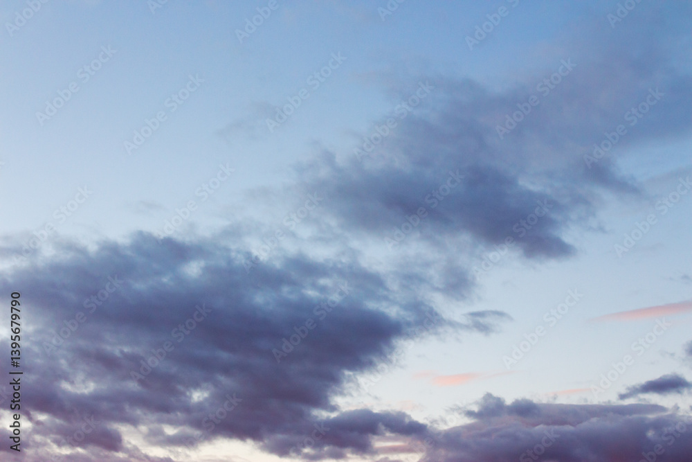 cumulus clouds on the sky at twilight. meteorology forecast. beautiful nature background in colorful light at sunset. windy winter conditions
