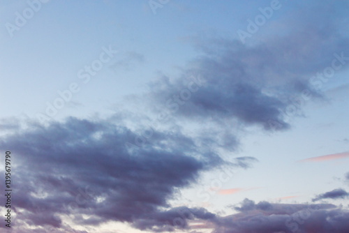 Obraz na płótnie cumulus clouds on the sky at twilight. meteorology forecast. beautiful nature background in colorful light at sunset. windy winter conditions w salonie