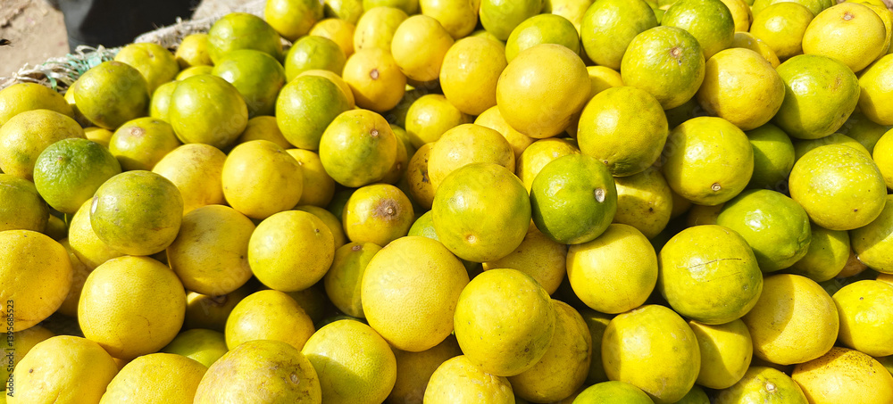 A pile of fresh lemon open sell in Indian market. A pile of fresh lemon open sell in Indian market.