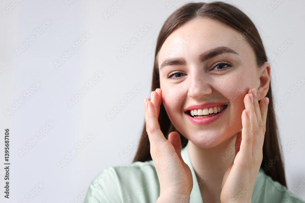 Smiling woman with healthy skin on grey background. Space for text Smiling woman with healthy skin on grey background. Space for text