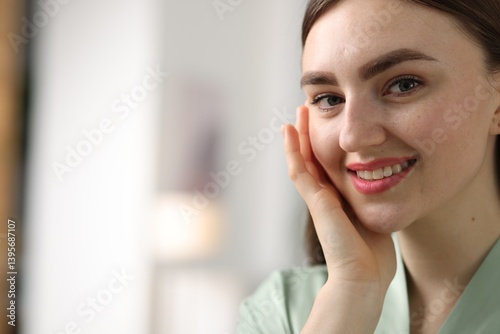 Free Download Smiling woman with healthy skin on blurred background, closeup. Space for text - GFXLoad