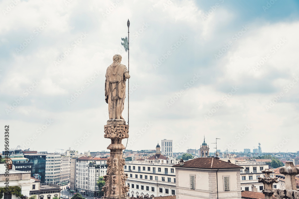 Obraz premium View from the rooftop of the Milan Cathedral (Duomo di Milano), one of the most famous Gothic cathedrals in the world, overlooking the city of Milan, Italy